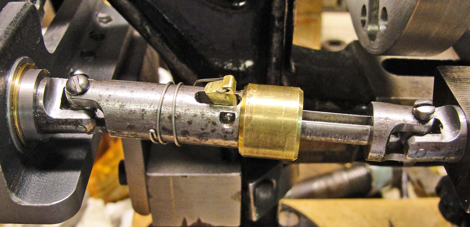 Drive shaft with pawl disengaged